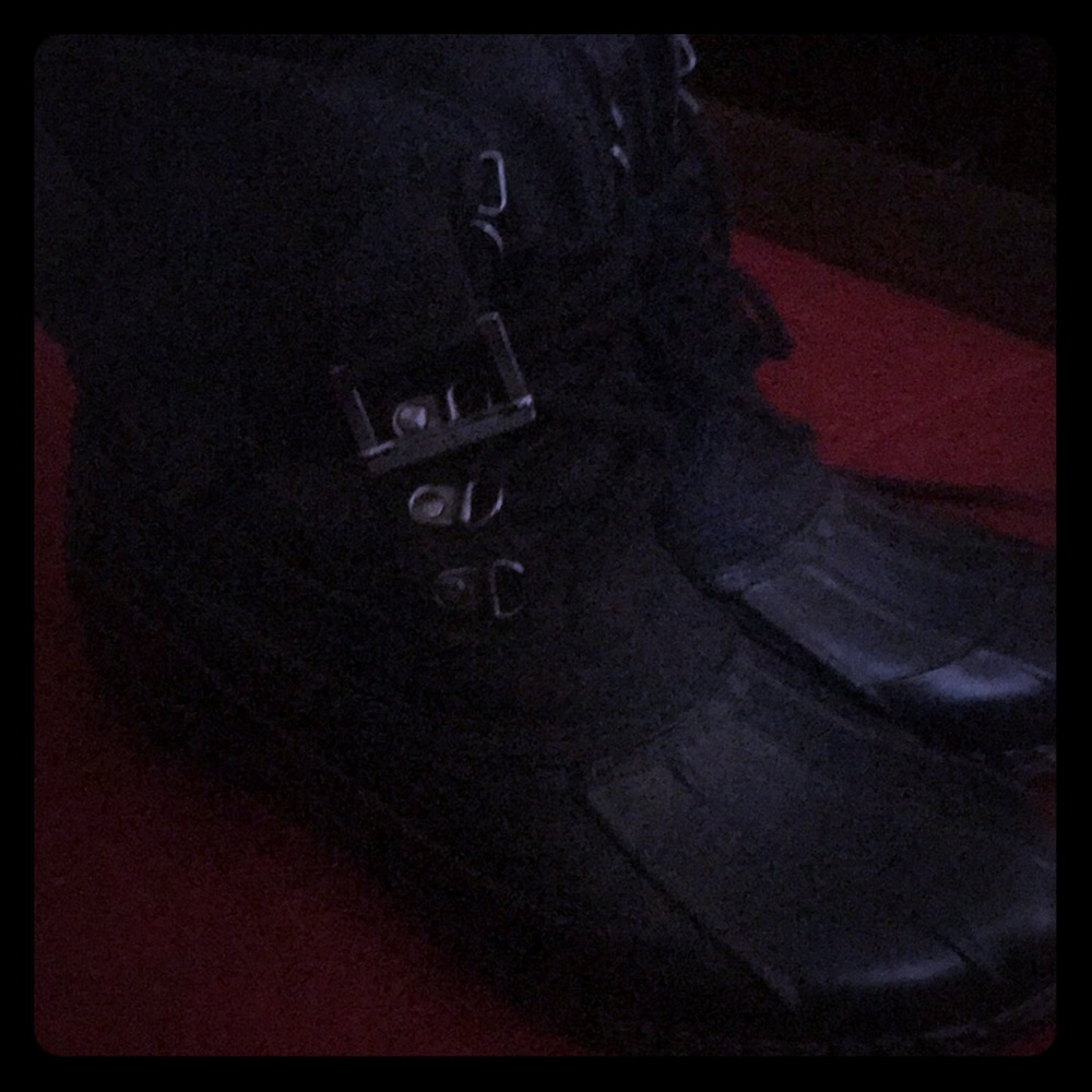 Black rain or snow boots short to ankle.